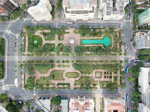 road aerial photography of green field during daytime gate