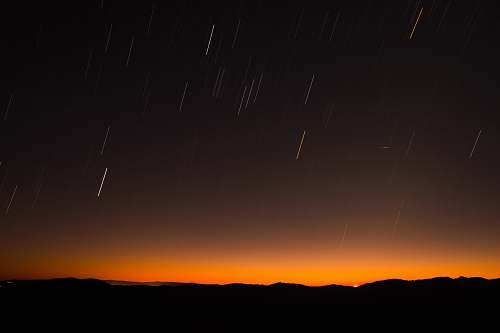 nature silhouette of hill during night time sky