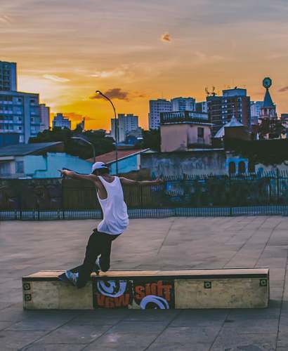 person man doing tricks on skateboard brazil