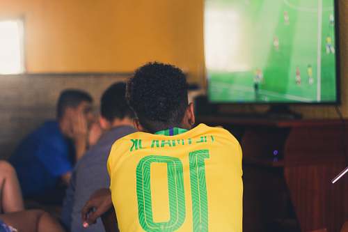 people man wears yellow and green jersey shirt person