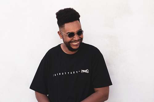 person smiling man wearing black t-shirt people