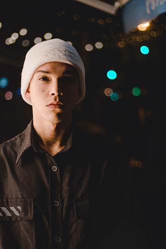 person standing man wearing white knitted cap people