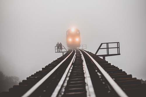 brazil man and woman standing beside trailway fog