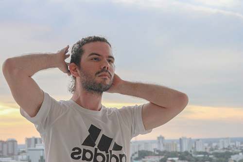 apparel man holding his hair clothing