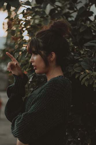 human woman standing beside tree people