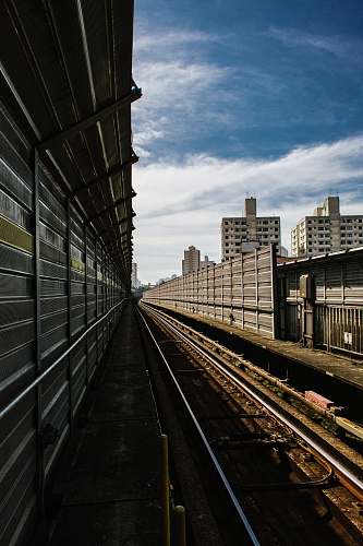 railway gray concrete wall train track