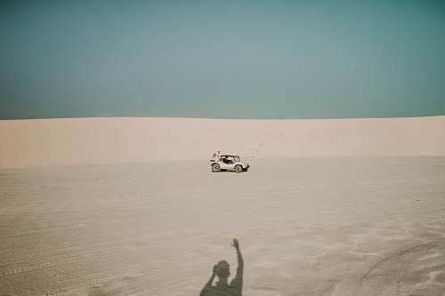 nature white ATV passing through dunes soil