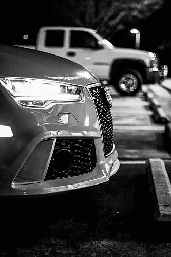 car grayscale photo of car with open door automobile