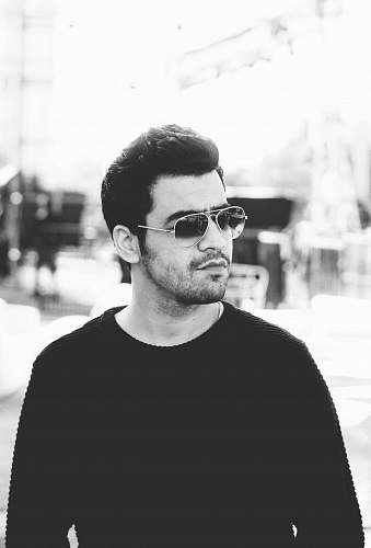 human man in black crew neck shirt wearing black sunglasses face