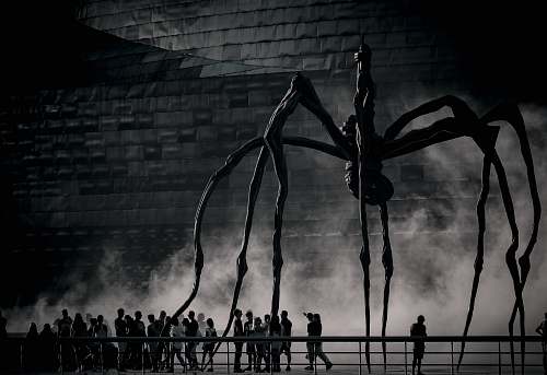 human silhouette of people standing on bridge person