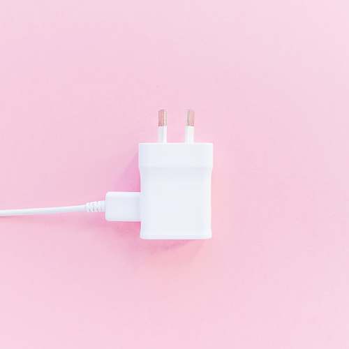 adapter white charger adapter on pink surface plug