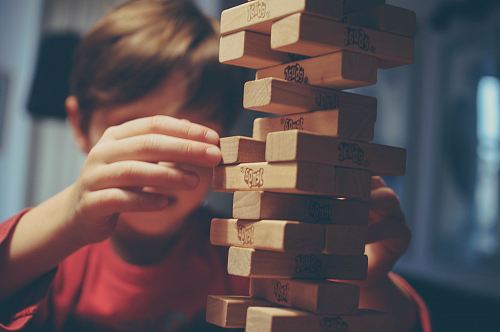 boy playing jenga