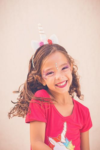girl in pink shirt smiling