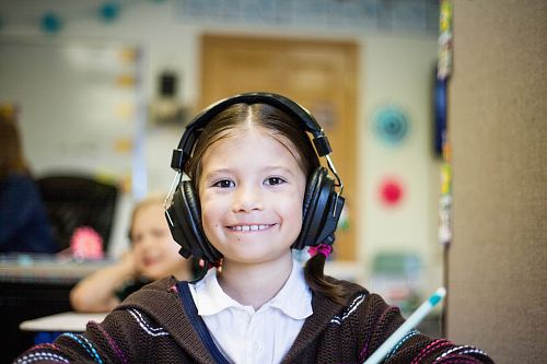 girl wearing black headphones