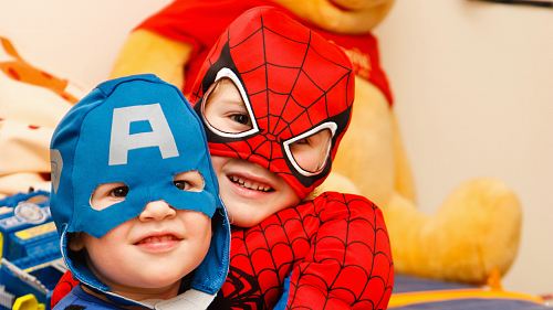 kids in spiderman and Captain America costumes