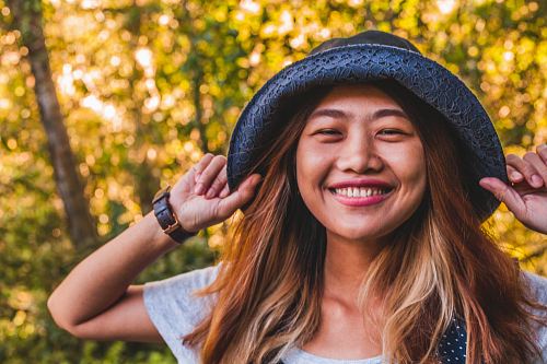 woman in grey shirt and black denim fans