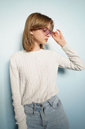 woman leaning k=on wall