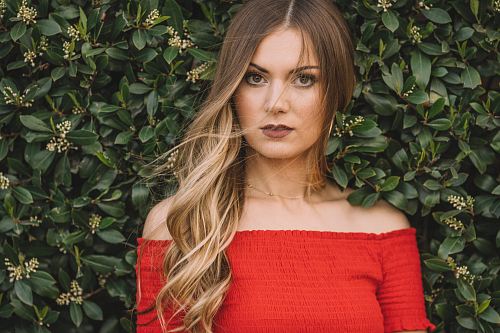 woman wearing red off-shoulder blouse