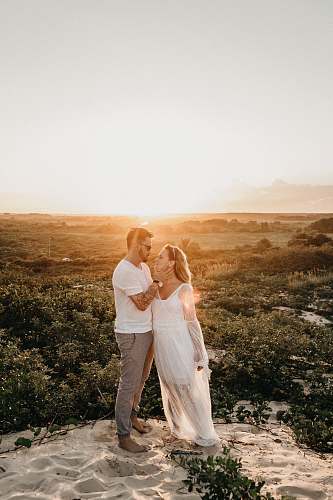 clothing man and woman wearing white clothes person