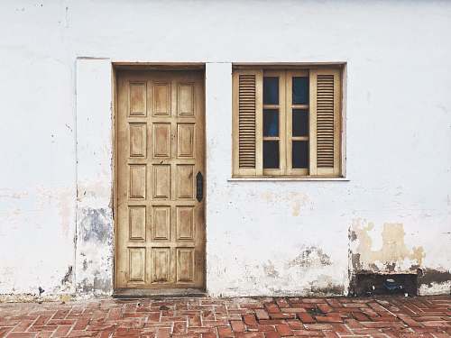brick brown wooden door closed door