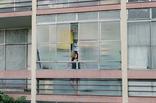 grey woman looking thru windows state of são paulo