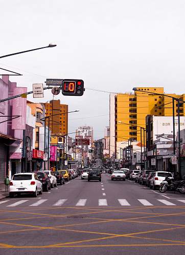 road vehicle on road suring daytime intersection