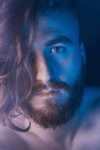 person man taking selfie inside dark room people