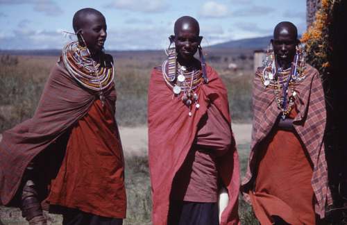 people three women wearing capes outdoors tribe
