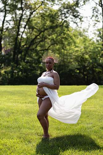 human pregnant woman holding her tummy people