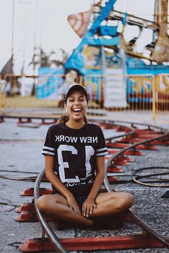 people woman wearing black and white crew-neck t-shirt on carnaval human