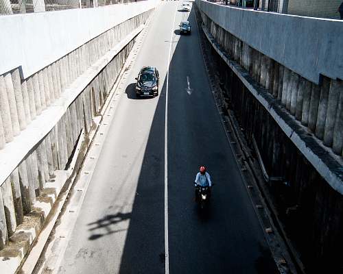freeway person riding motorcycle in street city