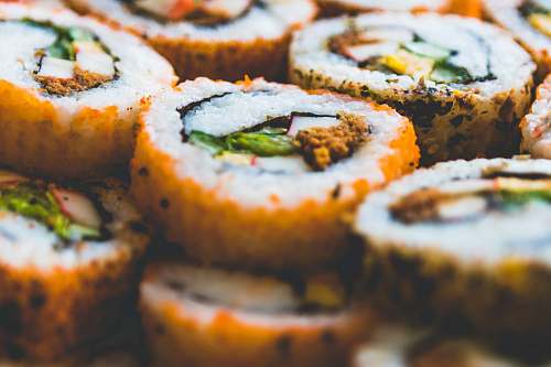 sushi shallow focus photography of California rolls burger