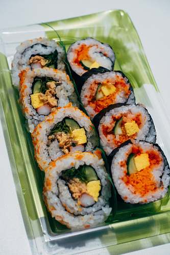sushi sliced cucumber on white ceramic tray cream