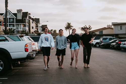 person four person walking near vehicle people