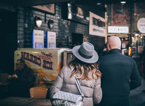 human man and woman facing Ice Cream truck hat