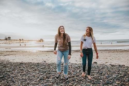 person two women walking on pebbles human