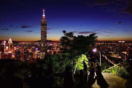 building photography of city during nighttime back