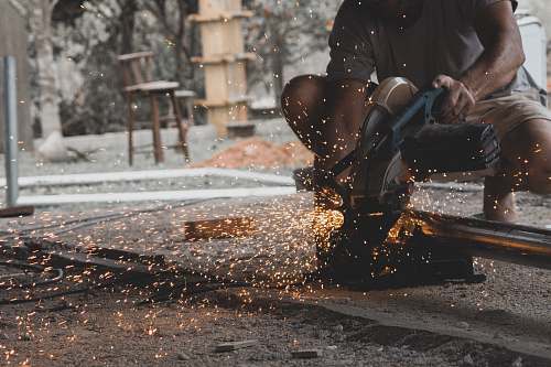 human man using miter saw person