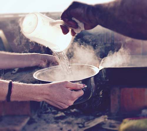 drink person pouring water on bowl milk