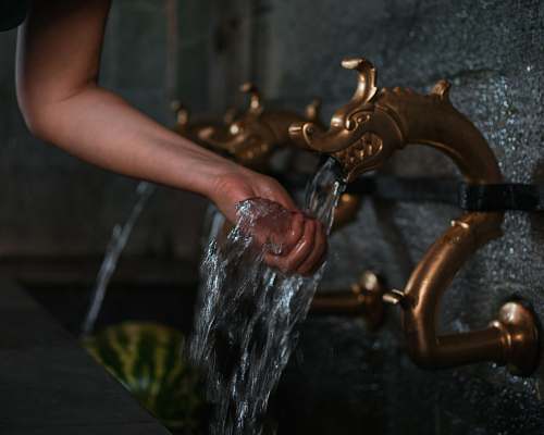 human person washing hand on flowing water st. john the forerunner bigorski monastery