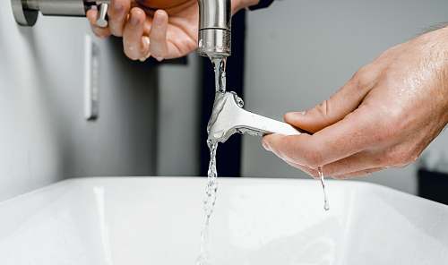 human silver faucet indoors