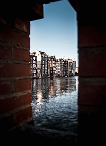 netherlands buildings near body of water brick