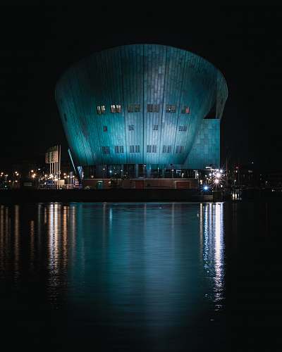 planetarium body of water near building during nighttime architecture