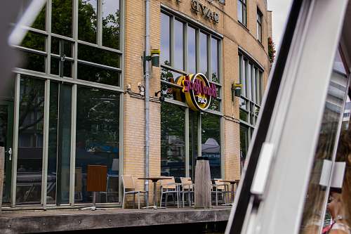 chair brown brick building with glass window restaurant
