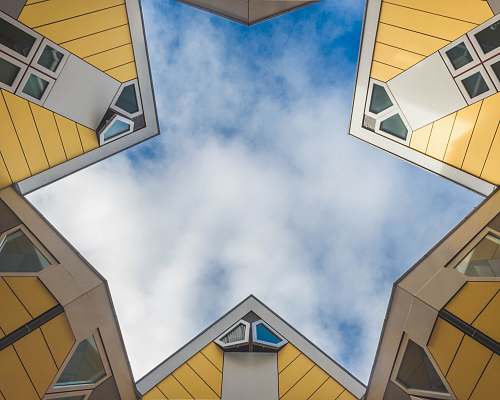 building low angle photography of blue sky rotterdam