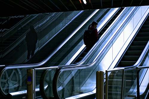 rotterdam woman standing at escalator escalator