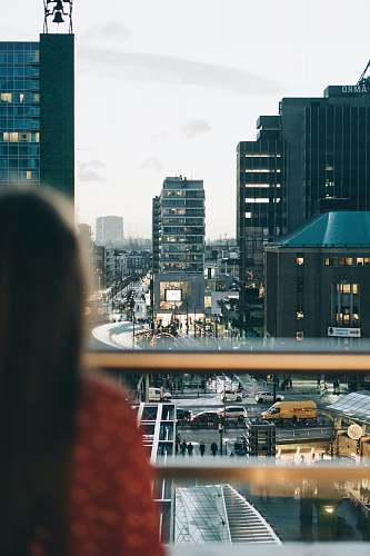 person selective focus photo of woman facing buildings human