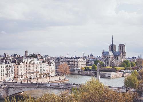 building city scale under white sky at daytime paris