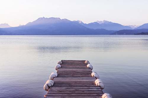 pier brown wooden boat dock in gray skies background dock