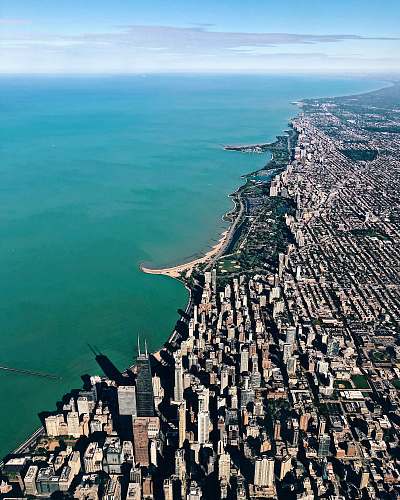 nature aerial photo of buildings near ocean outdoors